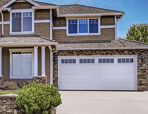 A Home with Stamped Shaker Garage Doors