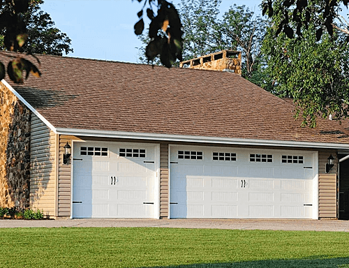 A Home with Stamped Carriage House Garage Doors