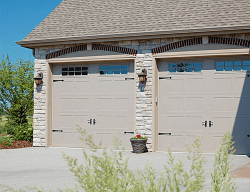 A Home with Stamped Carriage House Garage Doors